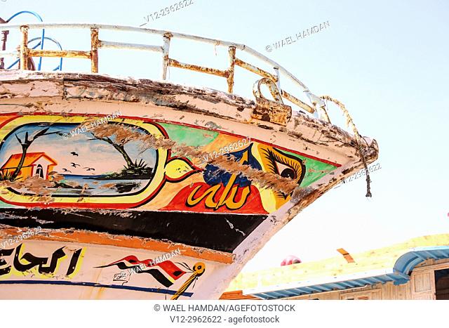 Painting work on new wooden boats on a dry dock, El-Burullos, Kafr El-Sheikh, Egypt, Africa