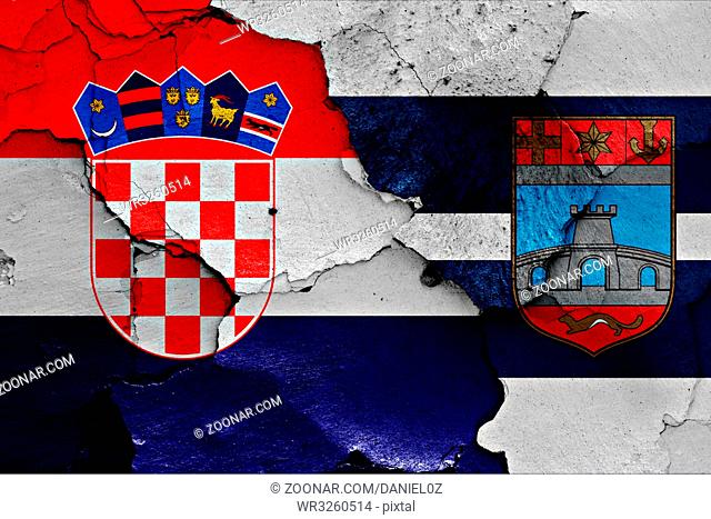 flags of Croatia and Osijek Baranja County painted on cracked wall