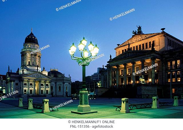 Lamppost lit up in front of cathedral and concert hall, Deutscher Dom, Gendarmenmarkt, Berlin, Germany