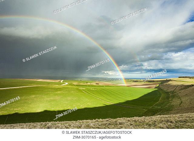 Rainbow and showers on the South Downs in early spring, West Sussex, England