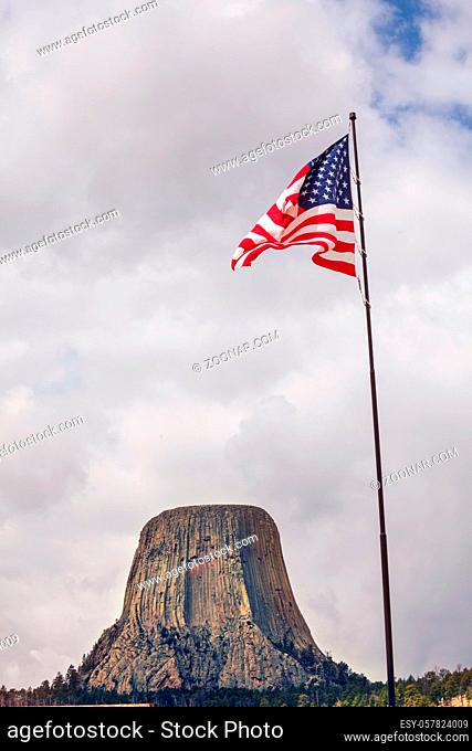 American flag on Devil's Tower National Monument background, U.S.A