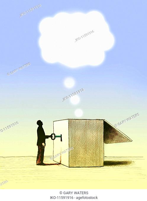 Man unlocking thought bubble from box