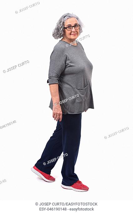 woman with sportsweare walking on white background