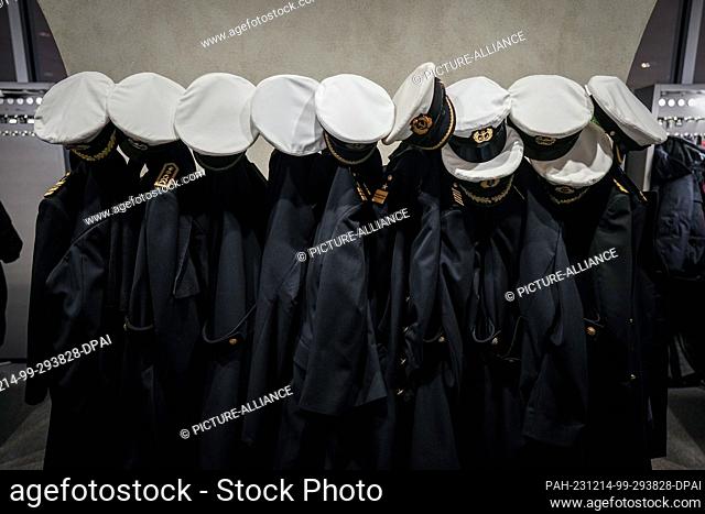 14 December 2023, Berlin: Caps and coats of Bundeswehr marines hang in the checkroom on the visitors' level in the Bundestag at the start of the session day