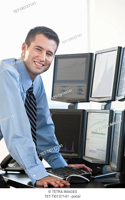 Trader at computer screens