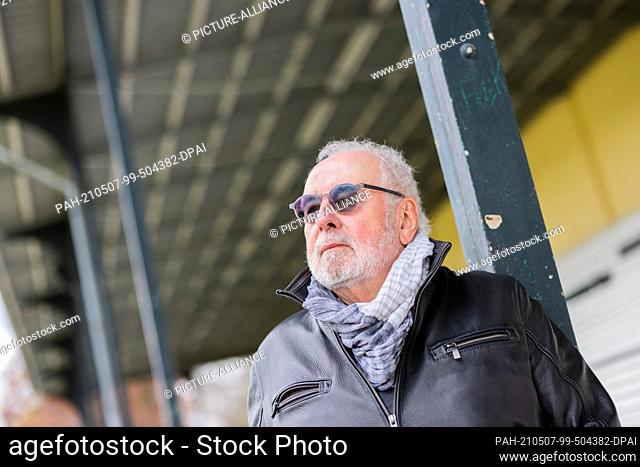 06 May 2021, North Rhine-Westphalia, Cologne: Heribert Faßbender, sports journalist, stands on the grounds of the Cologne-Weidenpesch racecourse