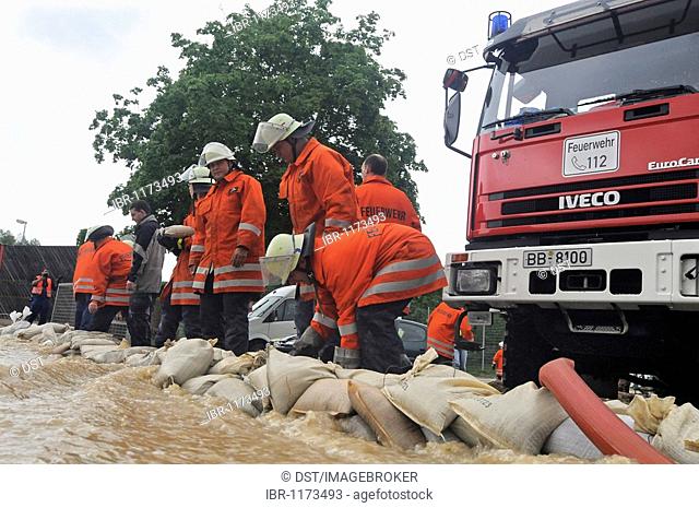 Firefighters in action after flooding by heavy rains, Weil der Stadt, Baden-Wuerttemberg, Germany, Europe