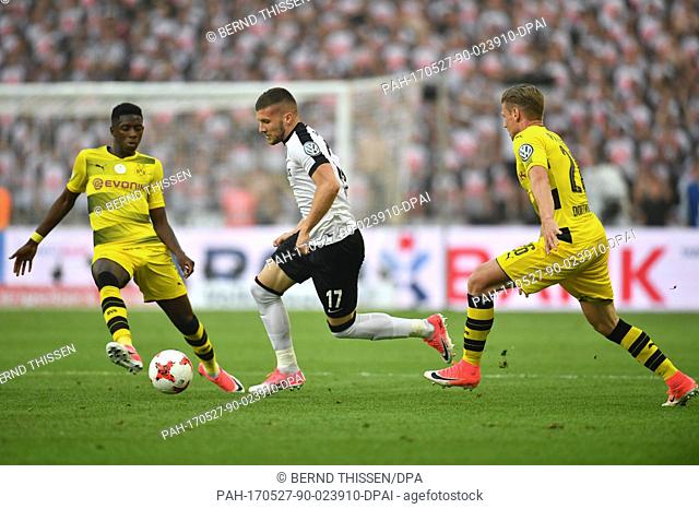 Dortmund's Ousmane Dembele (L) and Frankfurt's Ante Rebic (M) vie for the ball during the German DFB Cup final between Eintracht Frankfurt and Borussia Dortmund...