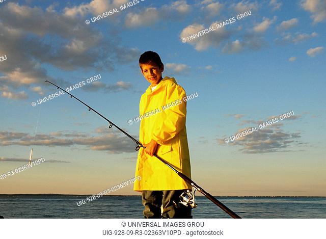 Boy With Fishing Gear In Yellow Slicker. Martha'S Vineyard, Massachusetts