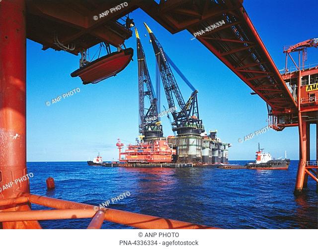 petrochemical offshore location, oil rig with floating cranes