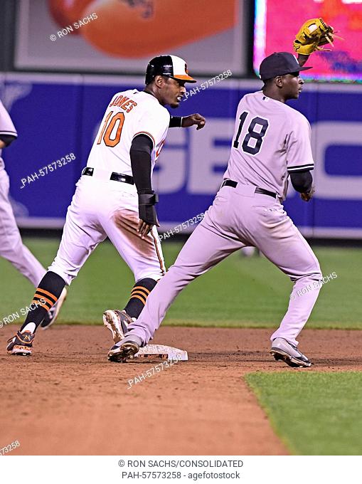 New York Yankees shortstop Didi Gregorius (18) catches Baltimore Orioles center fielder Adam Jones (10) attempting to steal second base in the eighth inning at...