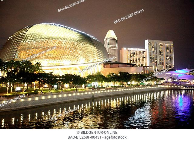 The skyline of the bank quarter in Singapore with the Esplanade in the evening light in the city centre of Singapore, Singapore