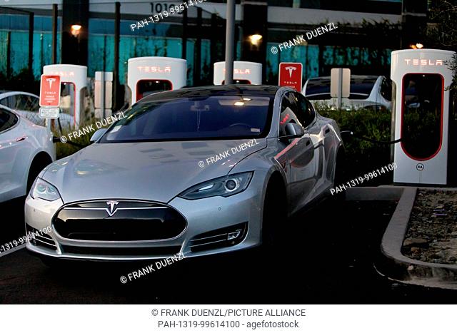 Teslas charging at the Supercharger at the Qualcomm parking lot in Sorrento Valley, where many high tech, biotech, and IT companies are located, in Febuary 2018