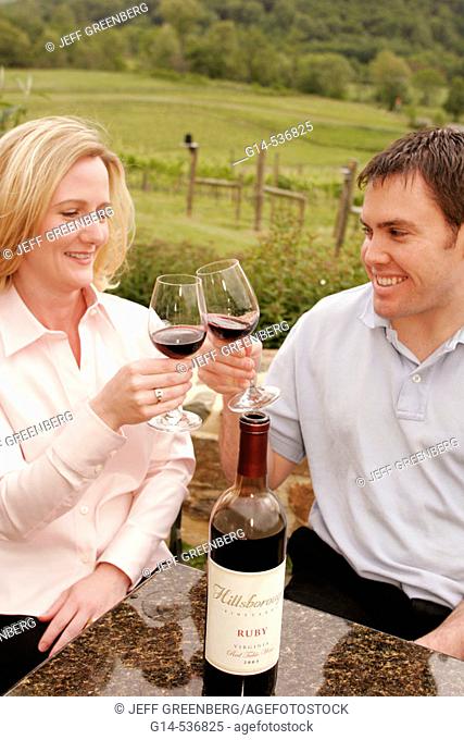 Virginia, Hillsboro, Hillsborough Winery, wine bottle, glasses, couple toasting, vineyard
