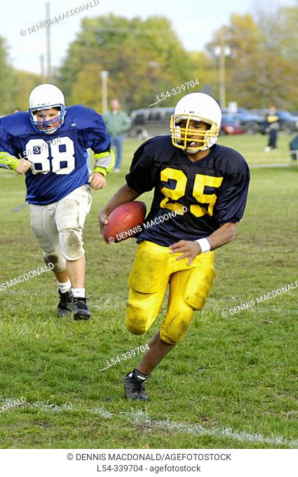 Middle 7th grade school football action between central middle school and Chippewa middle school located in Port Huron, Michigan. USA