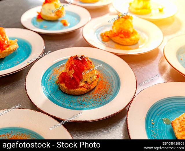 Vanilla ice cream served on the salty biscuit and decorated with sweet tomato jam