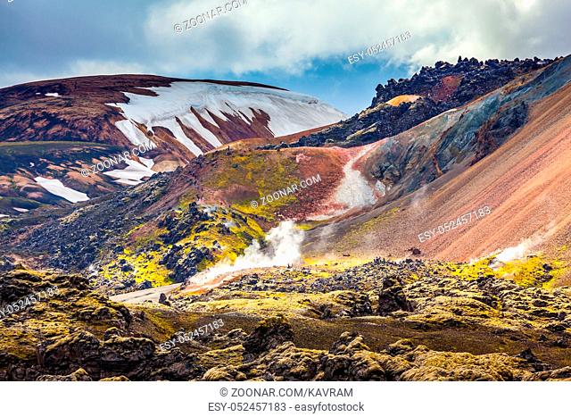 Valley National Park Landmannalaugar. On the gentle slopes of the mountains are snow fields and glaciers. Magnificent Iceland in the July