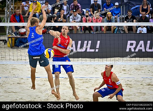 Czech Ondrej Perusic, centre, David Schweiner, right, in action during the 2021 Beach Volleyball World Tour 2 Star, match against Czech David Ahman and Jonathan...