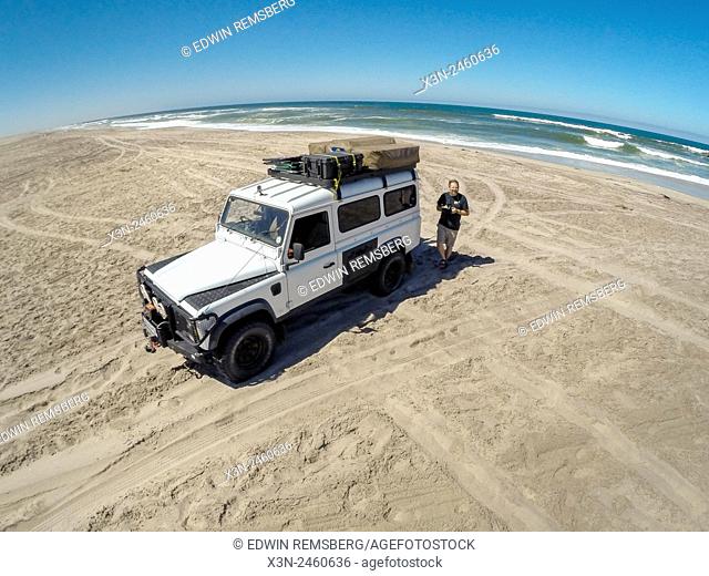 Henties Bay, Namibia, Land Rover Defender 110 parked on the beach