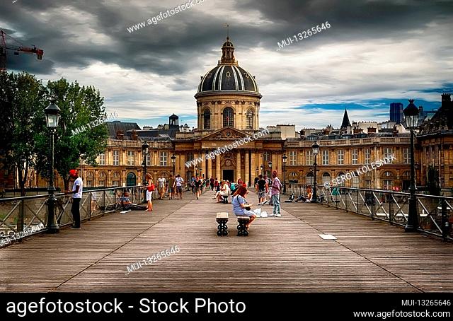 PARIS, FRANCE - AUGUST 26, 2016. View on facade of Institut de France in Paris from Pont des Arts at cloudy day