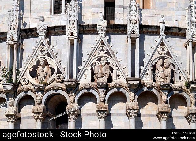 Virgin Mary with baby Jesus, St. John and St. Mark the Evangelist, Baptistery decoration architrave arches, Cathedral in Pisa, Italy