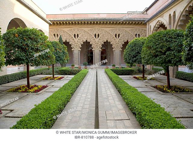 Low hedges and trees in the ornamental courtyard in the Palacio de Aljaferia palace, Moorish architecture, Zaragoza, Saragossa, Aragon, Spain