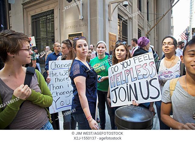 Chicago, Illinois - 'Occupy Chicago' members protest economic inequality in front of the Federal Reserve Bank  They are part of the 'Occupy Wall Street'...