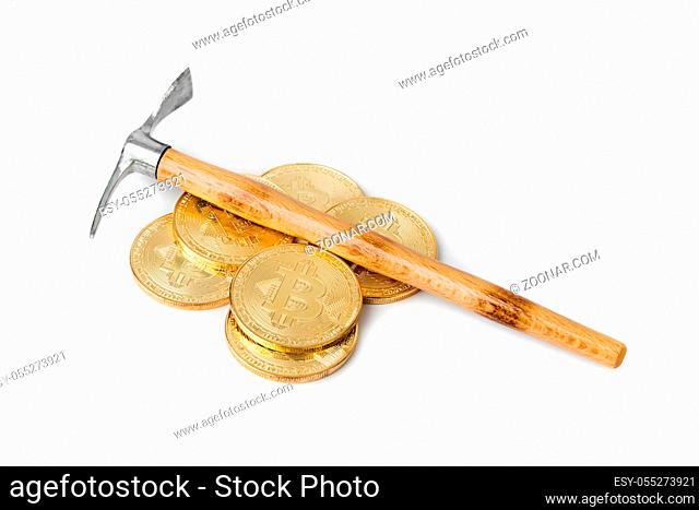Pickaxe and bitcoins isolated on white background