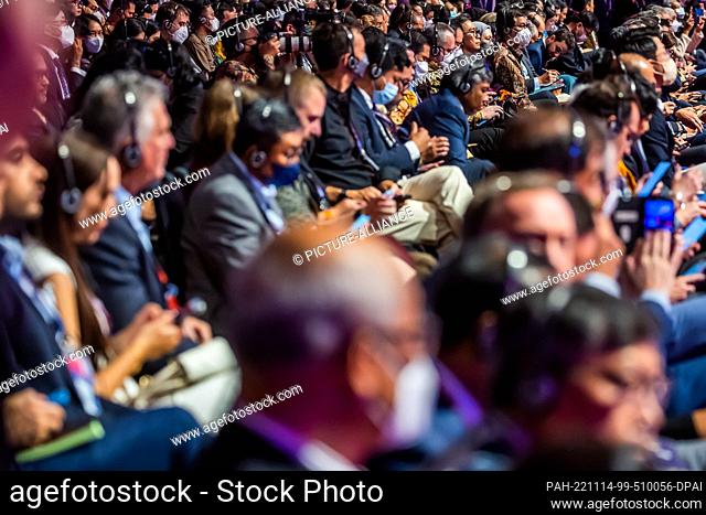 14 November 2022, Indonesia, Nusa Dua: Listeners watch an event at the B20 Summit, which precedes the G20 Summit. The meeting of the G20 group