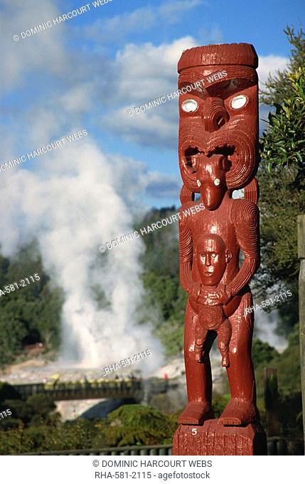 Traditional Maori carving and Pohutu geyser, Whakarewarewa, Rotorua, North Island, New Zealand, Pacific