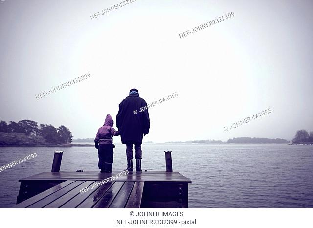 Mother with daughter on jetty