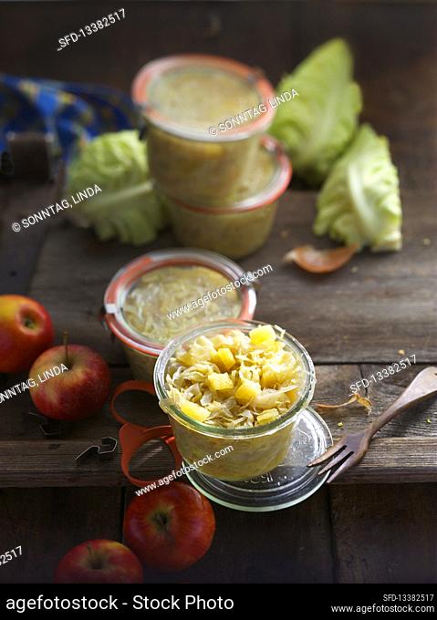 Preserved wine cabbage with apples in jars