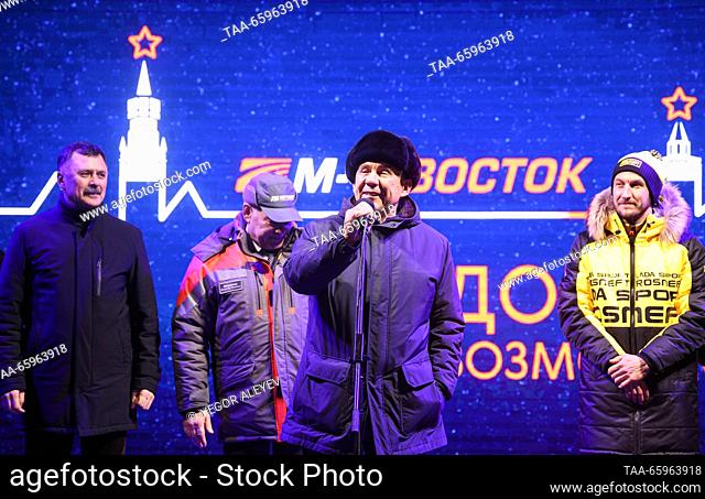 RUSSIA, KAZAN - DECEMBER 21, 2023: Head of Tatarstan Rustam Minnikhanov (front) speaks ahead of a motor race to start from the Kazan Kremlin and mark the...