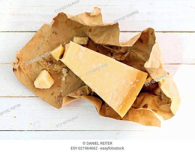 Wedge of hard granular Parmigiano-Reggiano cheese