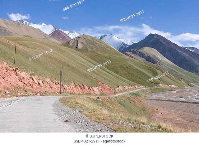 Kyrgyzstan, Osh Province, Road leading to mountains near Sary Tash