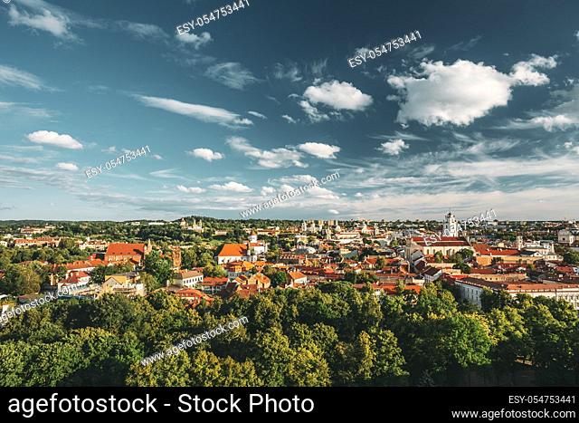 Vilnius, Lithuania. Old Town Historic Center Cityscape Under Dramatic Sky And Bright Sun In Sunny Summer Day. Travel Panorama. UNESCO World Heritage