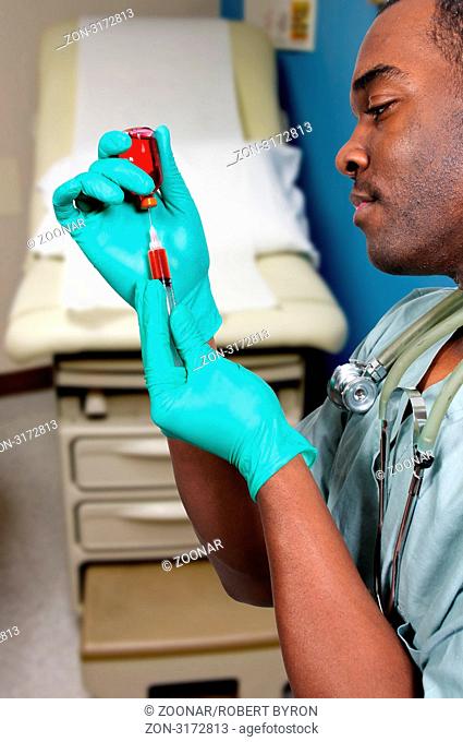 Black African American medical doctor preparing an injection in a syringe