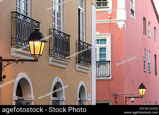 Facade of old colonial-style buildings with their balconies, lanterns and decorated windows in the Pelourinho neighborhood in the city of Salvador, Bahia