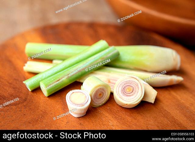 Fresh green lemongrass slices on wooden background
