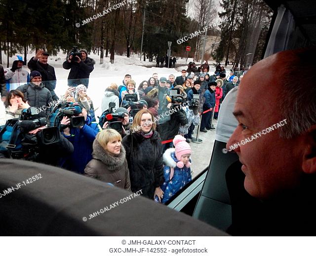 At the Gagarin Cosmonaut Training Center in Star City, Russia, Expedition 47-48 crewmember Jeff Williams of NASA looks out of the crew bus to well-wishers March...