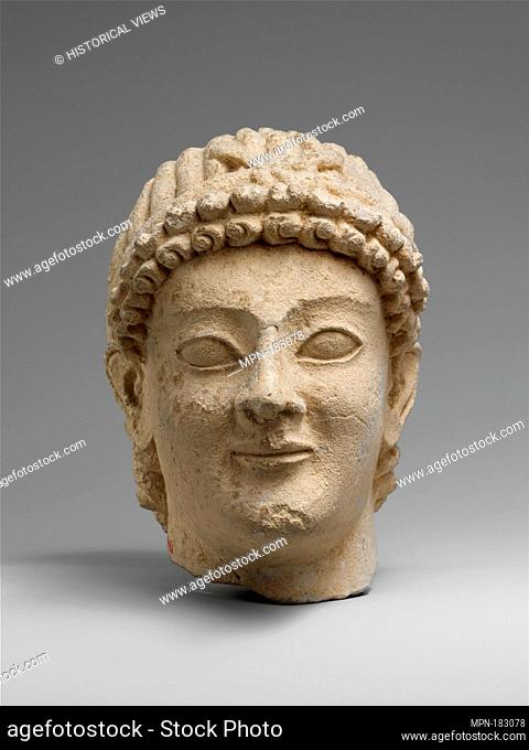 Limestone head of a wreathed youth. Period: Classical; Date: 5th century B.C; Culture: Cypriot; Medium: Limestone; Dimensions: Overall: 5 1/4 x 3 3/8 x 4 1/2 in