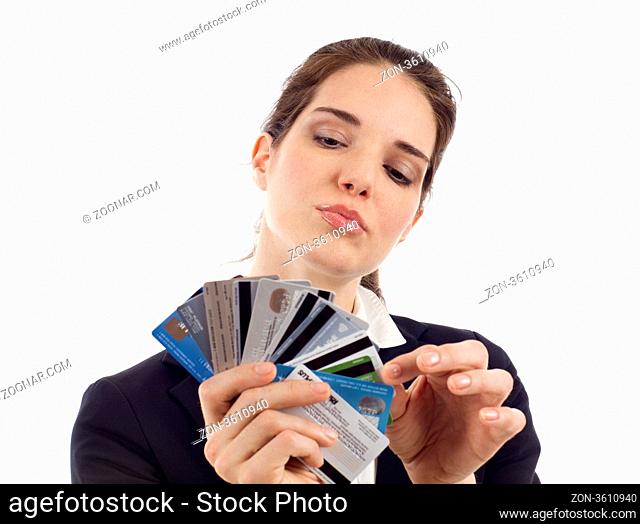 Business woman choosing which credit card to pay with, isolated over white