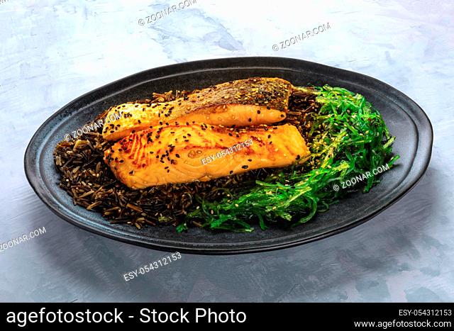 Salmon with sesame seeds, wakame algae and wild black long grain rice