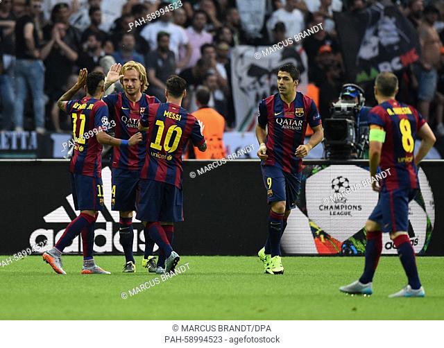 Barcelona's Ivan Rakitic (2-L) celebrates with Neymar (L-R), Lionel Messi, Luis Suarez and Andres Iniesta after scoring the first goal during the UEFA Champions...