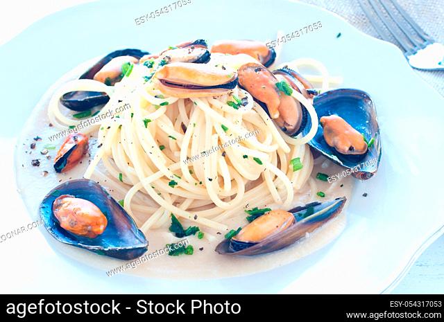 Pasta with mussels with cream of white beans, italy