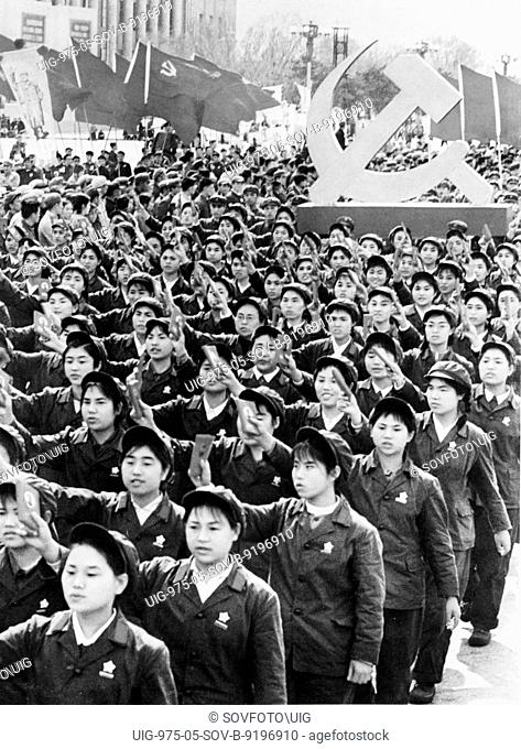 People holding up mao's little red book during a may day demonstration in beijing, china, may 1, 1969, cultural revolution