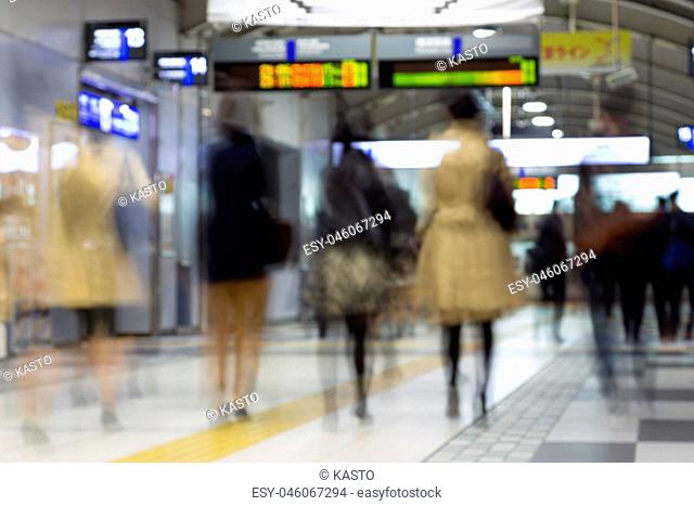 Business people traveling by Tokyo metro
