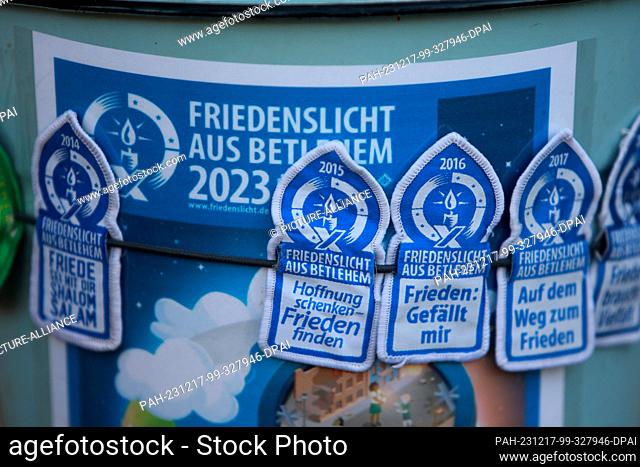 17 December 2023, Saxony-Anhalt, Halberstadt: View of patches with the inscription ""Peace Light from Bethlehem 2023"". The motto of this year's Peace Light...