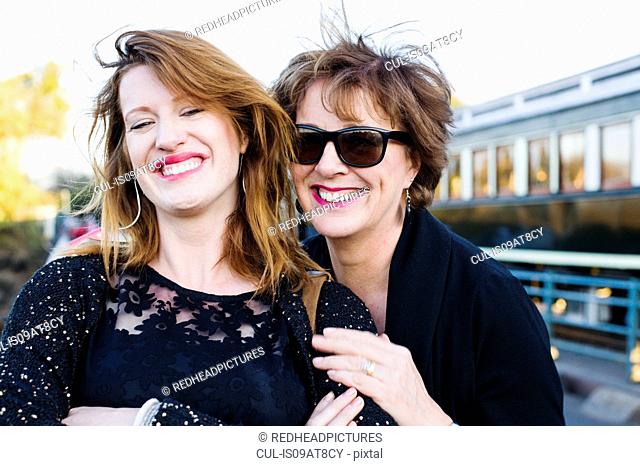 Portrait of mature woman and daughter on vacation