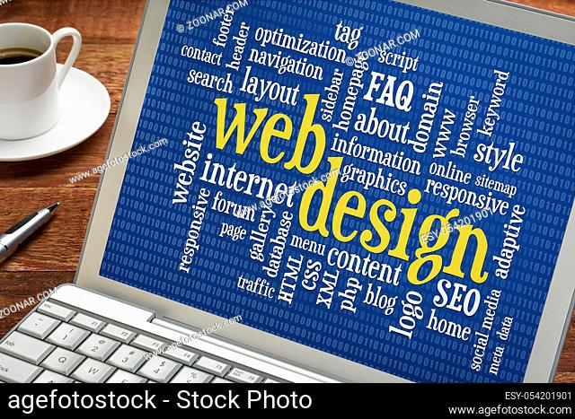 web design and development word cloud with binary background on a laptop screen